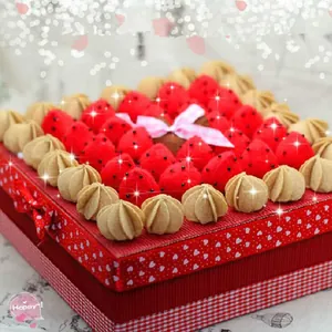 Detail of a handmade strawberry cake craft made from colorful non-woven felt fabric