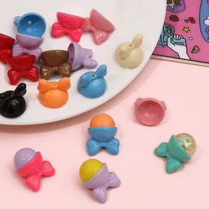 Close-up of colorful acrylic bow-tie hat charms with iridescent beads for DIY crafts.
