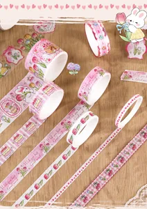 Detailed close-up showing pink washi tape rolls with cute tulip, rabbit, and heart patterns.