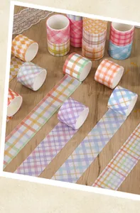 Detail view of colorful plaid pattern washi tapes for bullet journaling and DIY crafts.