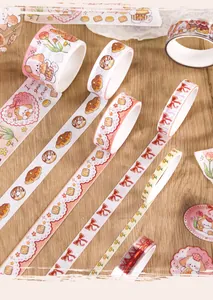 Close-up of various cartoon washi tapes featuring cute dogs and dessert patterns for DIY.