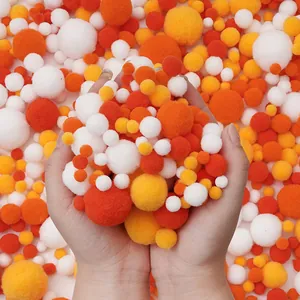 High-quality assorted polyester pom poms in white and orange for DIY creative craft projects