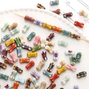 Colorful hand-painted bone-shaped ceramic beads for creative DIY jewelry and bracelets.