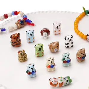 Assorted hand-painted ceramic animal beads for DIY jewelry making, cat bear panda designs