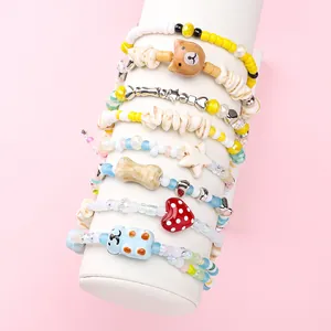 Close-up display of colorful DIY beaded phone straps with cute animal, star, and heart charms