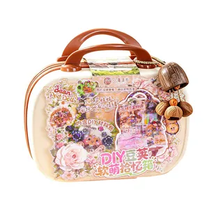 Portable DIY Bean Pod Doll suitcase with natural shell charms and decorative stickers