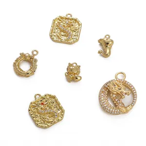Set of 14k gold plated dragon charms with cubic zirconia for DIY jewelry making.