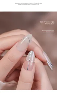 Detailed view of champagne silver mirror metallic nail art on manicured fingers.