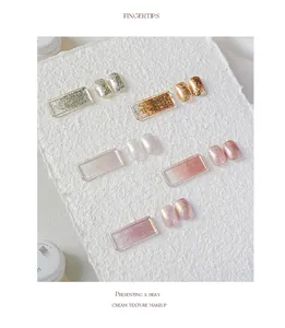 Close-up detail of high-density glitter nail gel swatches on white textured background.