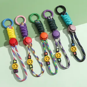 Vibrant woven rope keychains featuring smiley face beads and metal carabiner clips