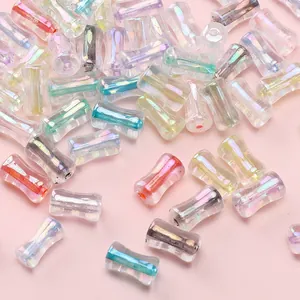 Macro shot of 4x8mm iridescent transparent bamboo-shaped glass beads for DIY jewelry.