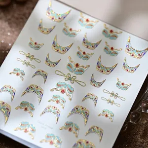Dunhuang mural style 3D embossed nail stickers with gold foil accents on a white sheet