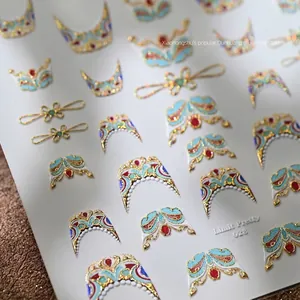 Detailed Dunhuang style embossed nail stickers with gold foil and traditional patterns