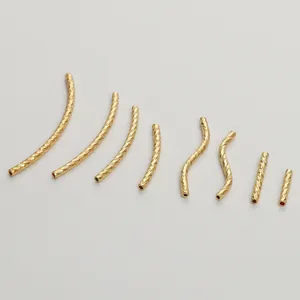 Detailed view of various diamond-cut gold-filled spacer tubes for DIY jewelry.