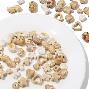 Detailed view of assorted beige ceramic beads for DIY necklace and bracelet crafting