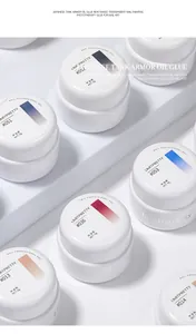 Detailed view of white pots of Japanese-style phototherapy nail polish gel with color labels