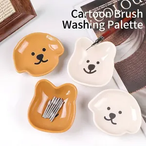 Palettes en céramique animaux de dessin animé pour nail art et support de pinceau.