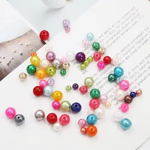 Detailed view of colorful high-gloss ABS imitation pearl round beads for DIY jewelry making