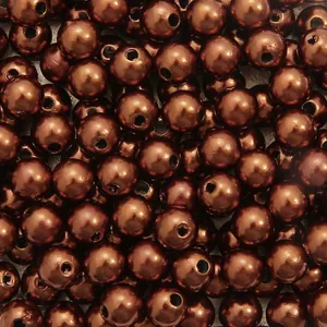 Macro detail of metallic brown ABS pearl beads with straight holes for DIY jewelry