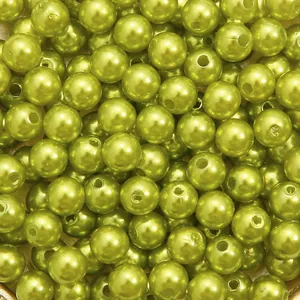 Detailed macro view of bright green ABS imitation pearl beads with straight holes