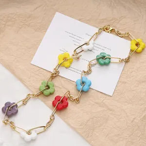 Detail of 16mm colorful glass flower beads on a vintage gold chain link necklace.
