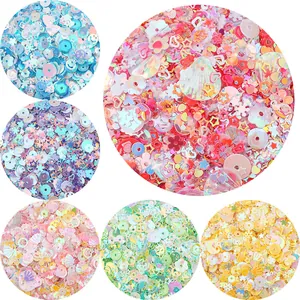 Macro view of assorted colorful DIY sequins in various shapes and iridescent finishes
