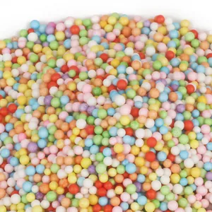 Detailed macro view showing a variety of multicolored foam beads for DIY craft filling
