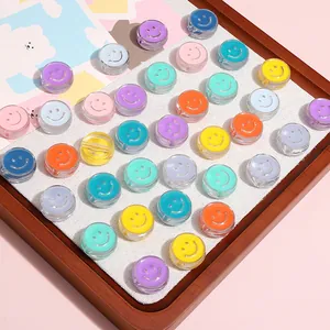 Close-up view of colorful 20mm acrylic round smiley face beads for DIY jewelry and crafts