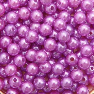 Close-up of vibrant purple high-gloss ABS imitation pearls with straight holes