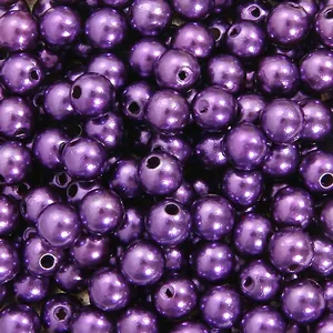 Detailed close-up of vibrant purple glossy ABS faux pearl beads featuring straight holes for DIY
