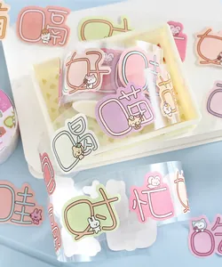 Macro view of transparent PET washi tape with cute cartoon animal and character stickers