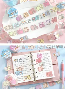 Close-up of cute die-cut masking tape with cartoon characters for journal decoration