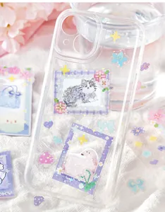 Detailed view of cute pixel art cat and dog stickers applied to a clear phone case