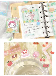 Close-up detail of cute pixel art food stickers and photo frame decals for journaling.