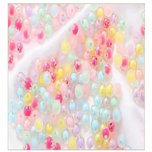 Detailed macro view of colorful acrylic heart-in-bead and frosted round beads for DIY jewelry