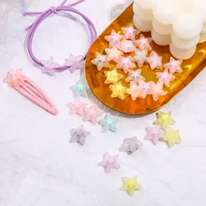 Detailed view of pastel frosted star acrylic beads and hair clips for DIY jewelry making projects
