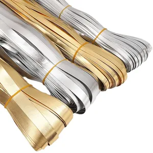 Shiny gold and silver PU leather binding strips for DIY craft projects and sewing.