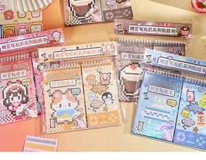 Close-up of DIY pixel art sticker books featuring a retro video game console theme