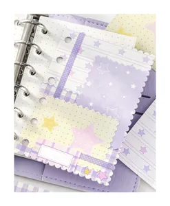 Close-up of pastel star-patterned loose-leaf memo paper in lavender binder