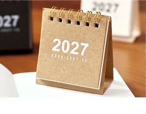 Détail du mini calendrier de bureau 2027 minimaliste avec reliure à double spirale.
