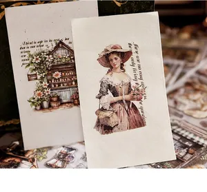 Macro detail of vintage PET transfer stickers featuring Victorian lady and floral shop designs