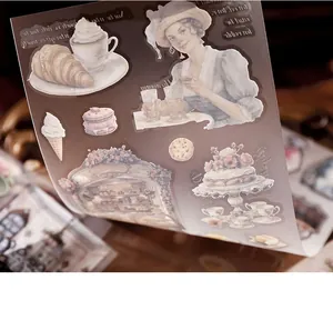 Detail view of vintage PET transfer stickers with coffee and croissant motifs for journaling.