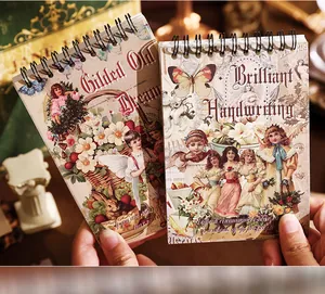 Vintage European style spiral sticker book featuring floral and angel illustrations
