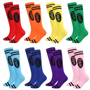 Detailed macro view showing a variety of colorful crayon themed knee-high socks for parties