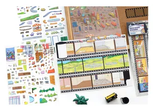 Macro detail of DIY scene stickers including furniture and landscape elements for scrapbooking