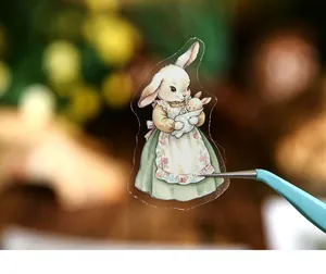 Detailed macro of a vintage bunny mother sticker for creative scrapbooking DIY projects.