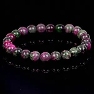 Detailed view of Ruby Zoisite beaded bracelet with natural pink and green patterns.