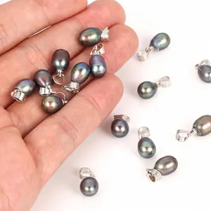 Macro detail of 7-8mm black peacock rice pearl pendants for jewelry making