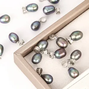 Detailed macro shot of 7-8mm black iridescent rice pearl pendants for jewelry making