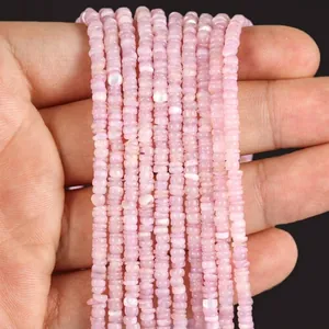 Close-up of 3mm light pink shell disc slice beads for DIY jewelry making projects.